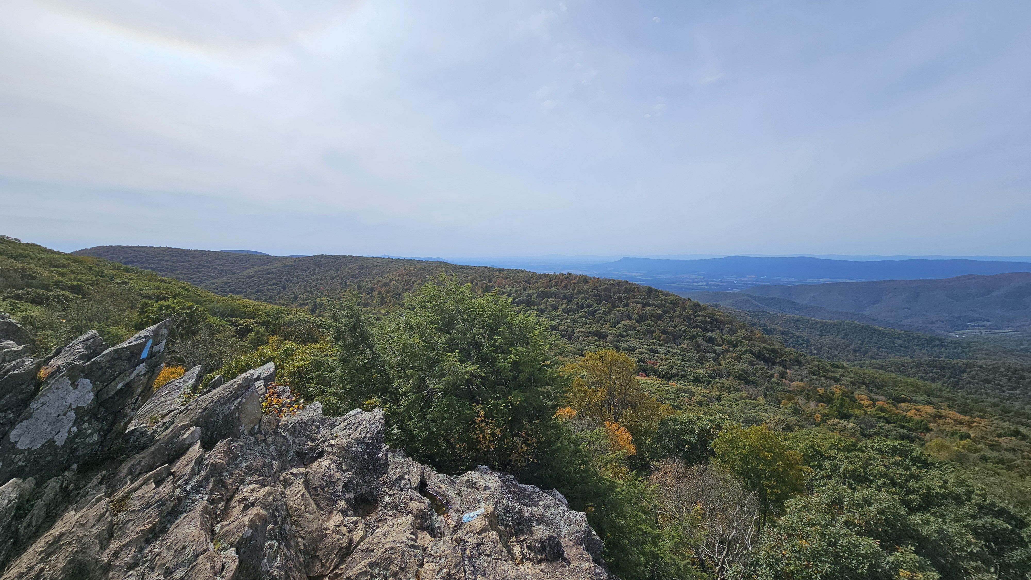 Bearfence Mountain rock scramble overlooking Blue Ridge Mountain ridges in Shenandoah National Park
